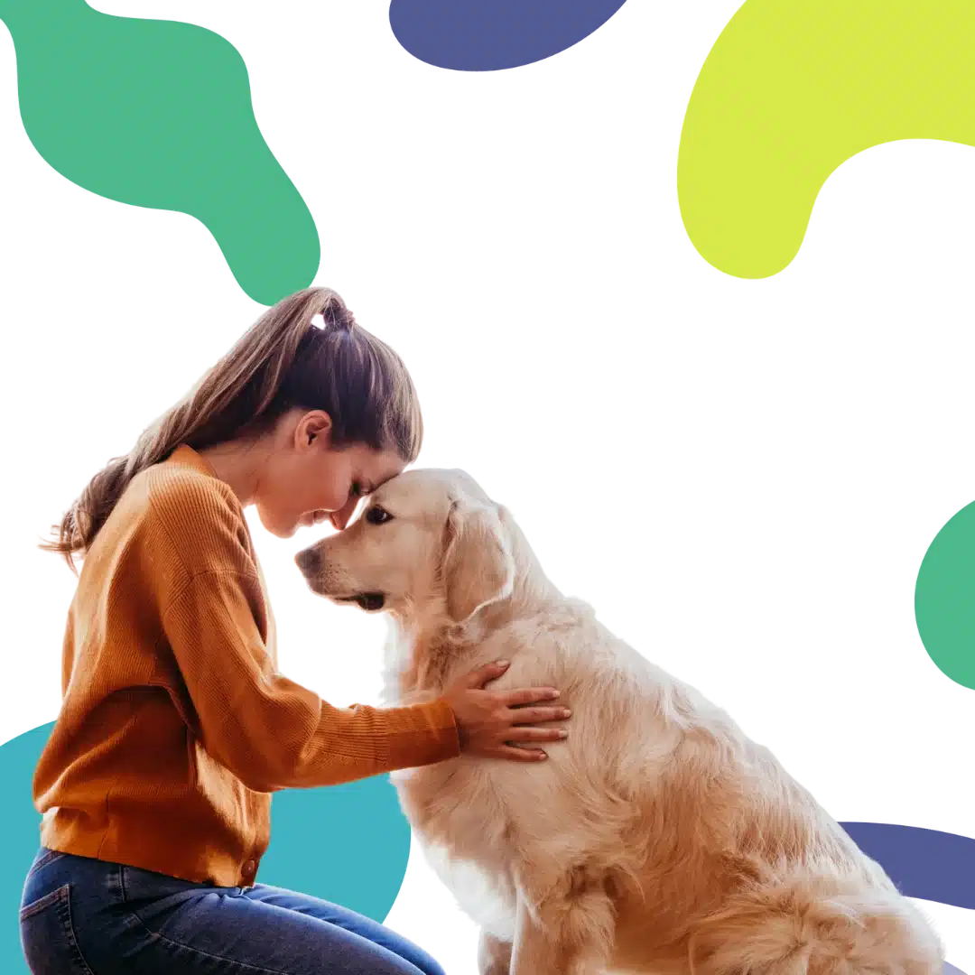 Woman kneeling and touching foreheads with a golden retriever against a colorful abstract background, showing a close bond.